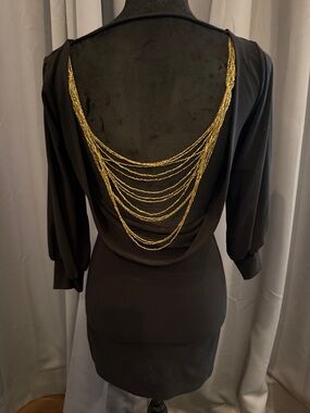Forplay Classic Black Long-Sleeve Sheath Dress with gold chains on back.